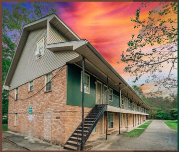 Hammond apartment for rent - an image of a building with a sunset behind it
