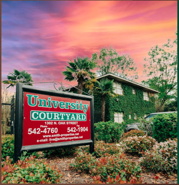 Hammond apartment for rent - a sign in front of a house with palm trees