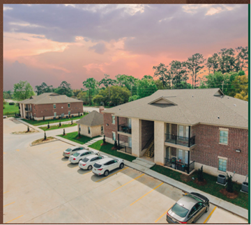 Hammond apartment for rent - an aerial view of a building with cars parked in front of it