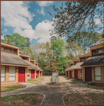 Hammond apartment for rent - a row of houses with trees in the background