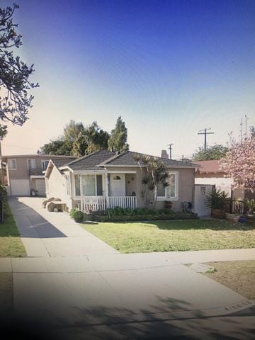 Lawndale apartment for rent - A residential street with houses and a sidewalk.
