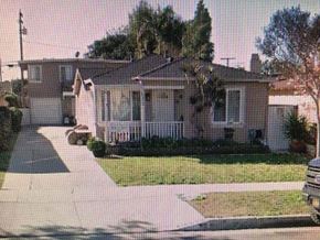 Lawndale apartment for rent - A house with a driveway and a tree in front.