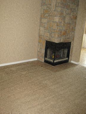 Kansas City townhouse for rent - a fireplace in the corner of a living room