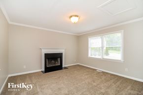 Winston-Salem house for rent - A room with a fireplace and a window.