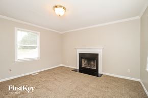 Winston-Salem house for rent - A room with a fireplace and a window.