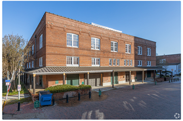 Baton Rouge apartment for rent - a large brick building on the corner of a street