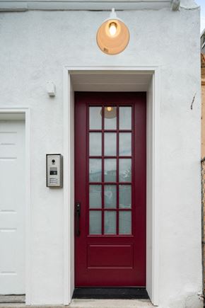 Philadelphia apartment for rent - the front door of a white house with a red door