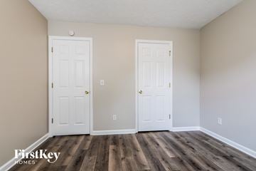 Loganville house for rent - the living room of a home with two white doors