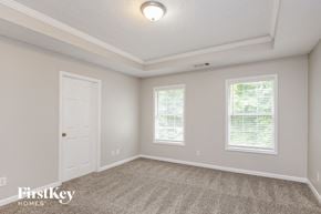 Lawrenceville house for rent - the upstairs bedroom has a door to the closet and a carpeted floor