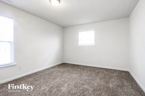 Avon house for rent - a bedroom with white walls and carpet and a window