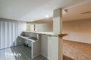 Saint Louis house for rent - a kitchen with a counter top and a staircase in a house