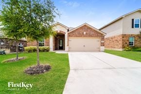 San Antonio house for rent - an empty driveway in front of a house with a tree