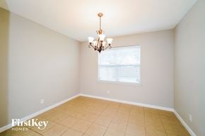 San Antonio house for rent - a dining room with a chandelier and a window