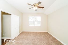 San Antonio house for rent - a bedroom with a ceiling fan and a closet