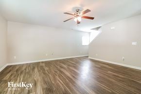 Lexington house for rent - a living room with hardwood floors and a ceiling fan
