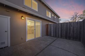 Vacaville apartment for rent - a patio in front of a house with a wooden fence