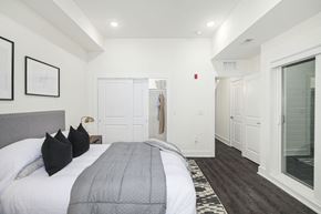 Philadelphia apartment for rent - a bedroom with a bed and a closet
