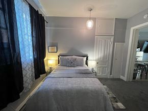 Fort Wayne apartment for rent - a small bedroom with a bed and a window
