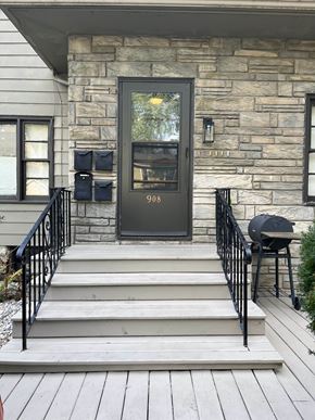 Fort Wayne apartment for rent - the front door of a house with stairs and a porch
