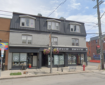 Hamilton apartment for rent - an old building on the corner of a city street