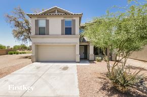 San Tan Valley house for rent - A house with a garage and a tree in front.