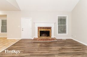 Greensboro house for rent - the living room with wood floors and a fireplace