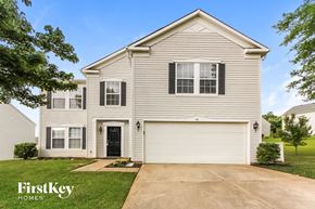 Mount Holly house for rent - a white house with a black door and a driveway