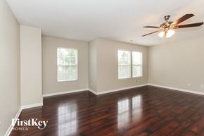 Mount Holly house for rent - the living room with hardwood floors and a ceiling fan