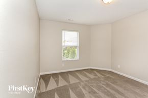 Mount Holly house for rent - a bedroom with a window and a carpeted floor