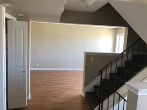Prince Albert house for rent - a view of the living room from the bottom of the stairs