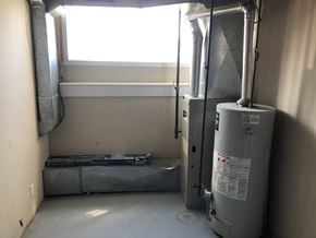 Prince Albert house for rent - a room with a water heater and a window