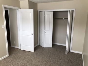 Prince Albert house for rent - a bedroom with two closets and two doors
