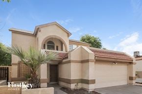 Phoenix house for rent - a house with a palm tree in front of it
