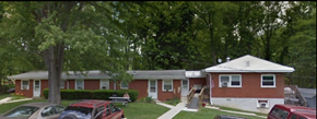 Goshen apartment for rent - A red car is parked in front of a house.