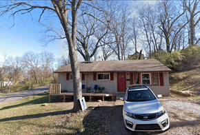Cincinnati house for rent - A white car is parked in front of a house.
