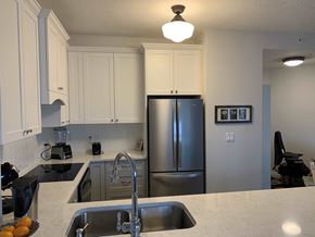 Edmonton house for rent - a kitchen with a sink and a refrigerator