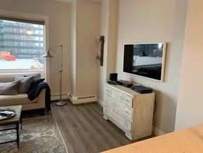 Edmonton house for rent - a living room with a tv and a couch