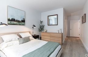 Stamford apartment for rent - a bedroom with a bed and a mirror