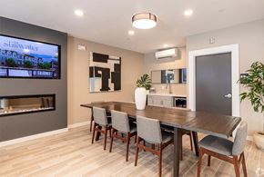 Stamford apartment for rent - a dining room with a wooden table and chairs