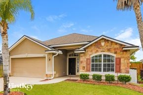 St Augustine house for rent - a beige house with a garage and palm trees