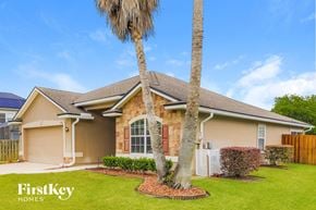 St Augustine house for rent - a home with two palm trees in front of it