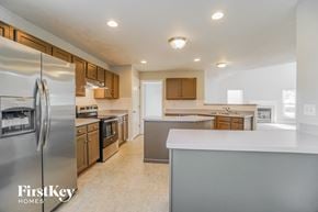 Columbus house for rent - a kitchen with stainless steel appliances and a white counter top