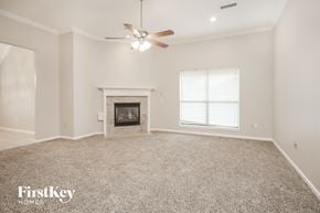 Baytown house for rent - the spacious living room with fireplace and ceiling fan