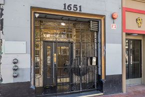 San Francisco apartment for rent - A building with a black gate and a sign that reads 1651.