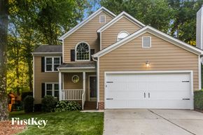 Charlotte house for rent - A two-story house with a garage is for sale.