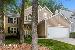 Charlotte house for rent - A house with a garage is shown in the image.