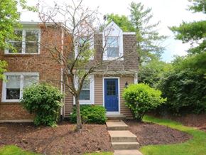 Maineville house for rent - A house with a blue door and a tree in front.