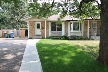Guelph apartment for rent - a small brick house with a sidewalk in front of it
