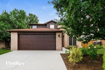 Little Elm house for rent - a home with a brown garage door and a driveway