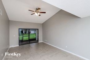 Melbourne house for rent - the spacious living room with ceiling fan and tile flooring